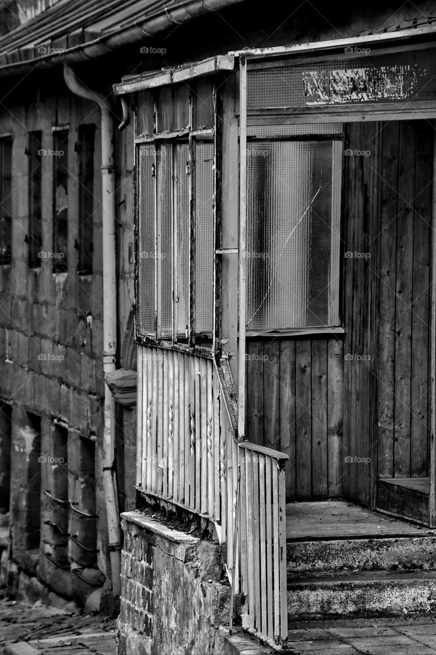 Black and white photo of an old derelict building