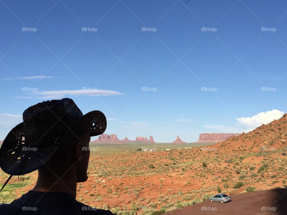 A man is looking the landscape of the monument valley,Utah
