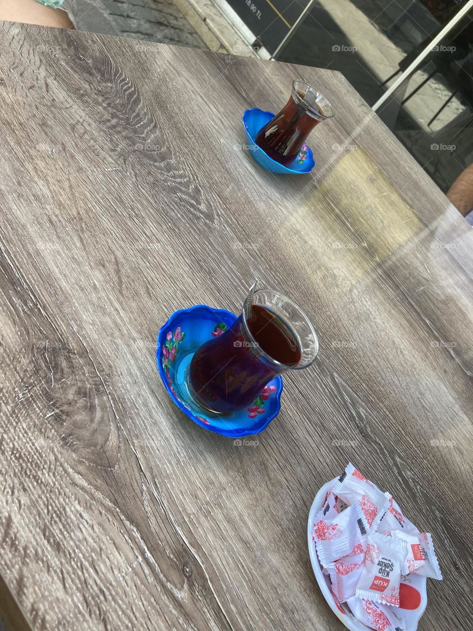 Turkish tea. Sunny holidays I’m Turkey. Walk in the cute city and charming streets by the beach in Kusadasi. perfect blue sky and ocean view. Beach and the shore. To travel is to live. Gorgeous tall palm trees.