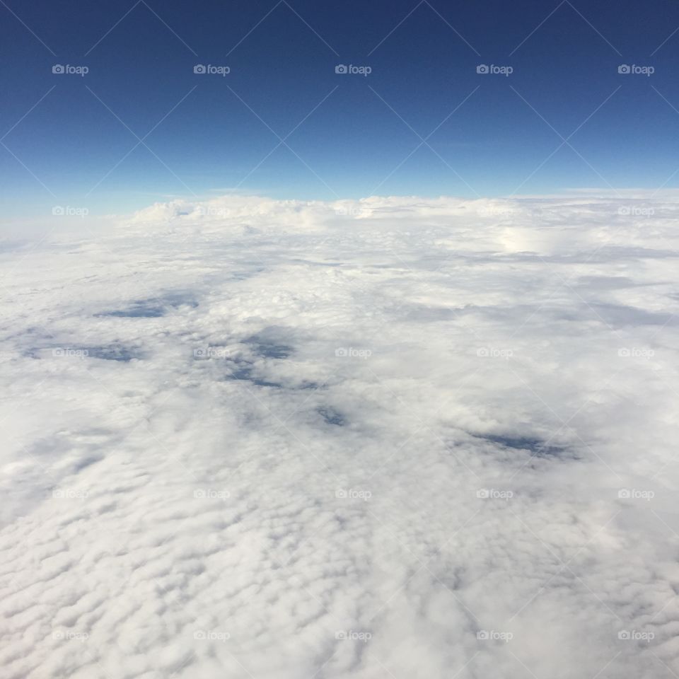 Smooth cloudscape from a plane, perfect for writing inspirational slogans or the backdrop of text