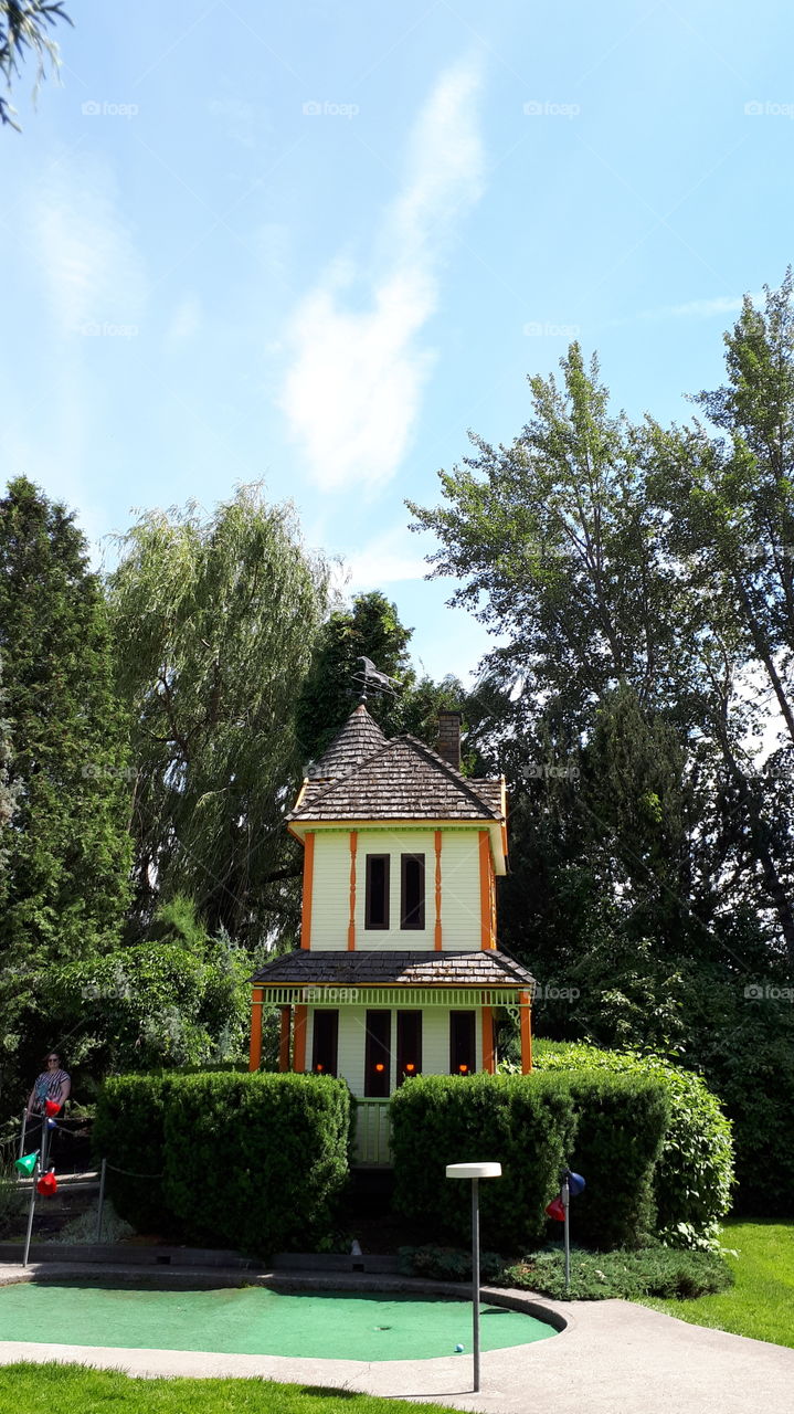 Miniature house in a miniature golf garden