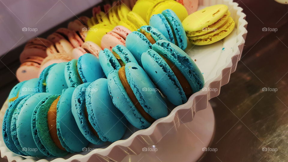 What is better for life than sweetness? Blue, yellow and light pink macarons, photos taken in a small sugar factory in my city.