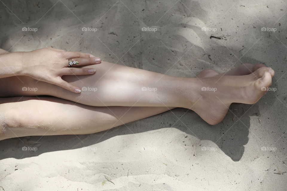 feet in the sand. girls feet in the sandy beach