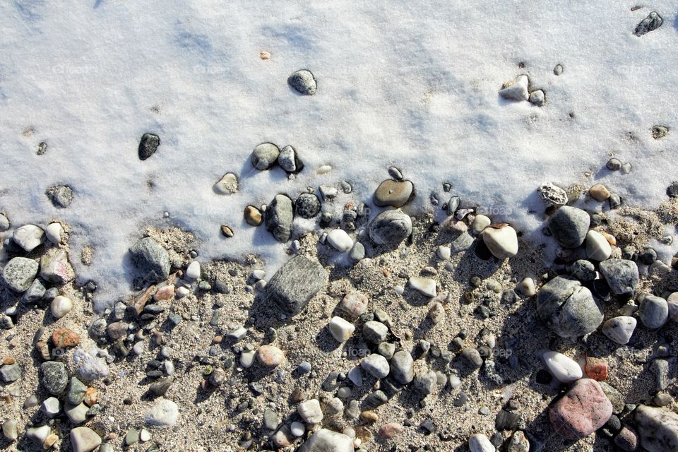 Snow, rocks and sand