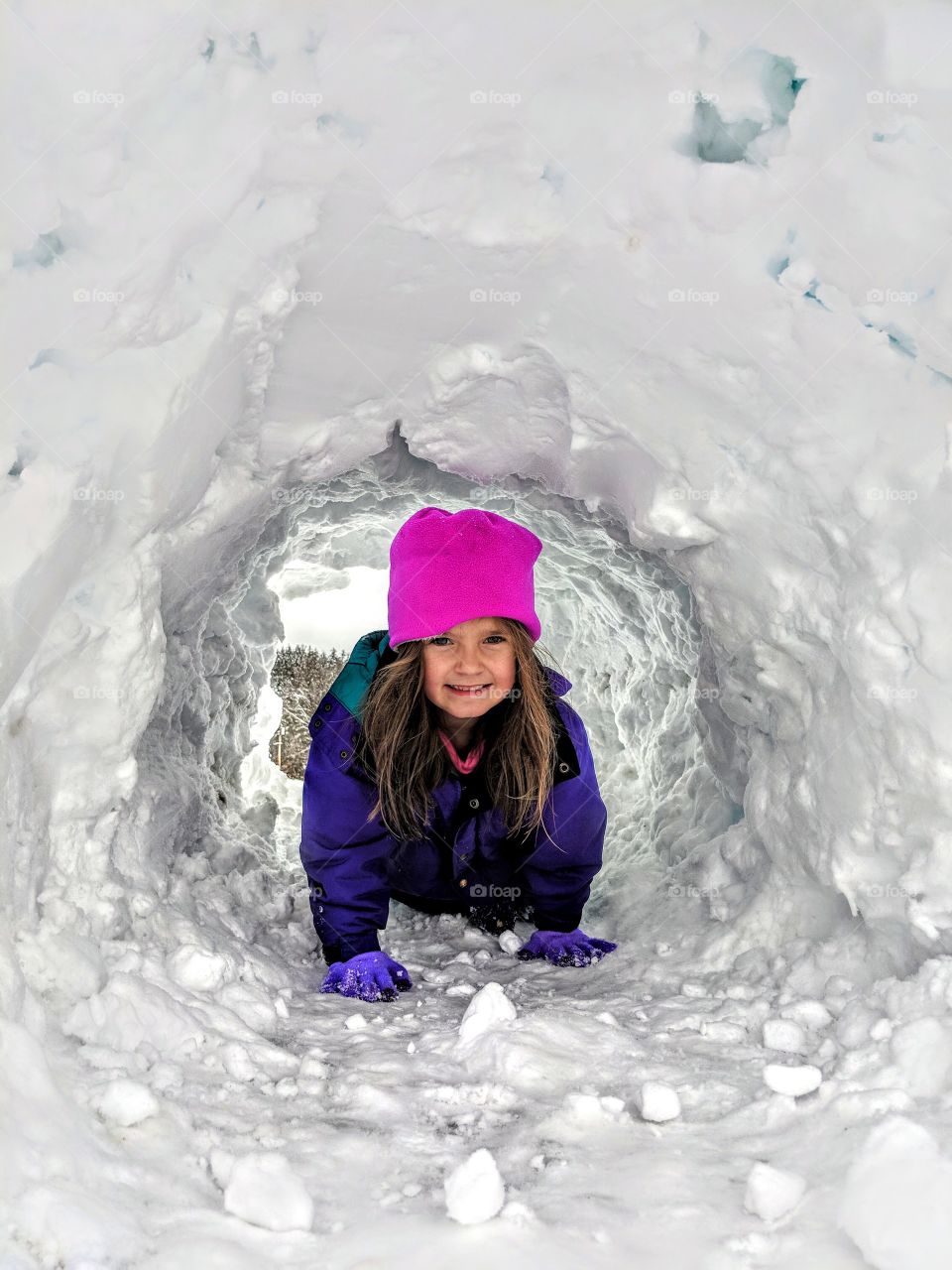 crawling through snow tunnel