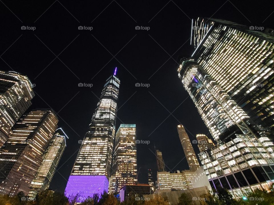 One World Trade Center rises high above New York City on a beautiful clear fall evening