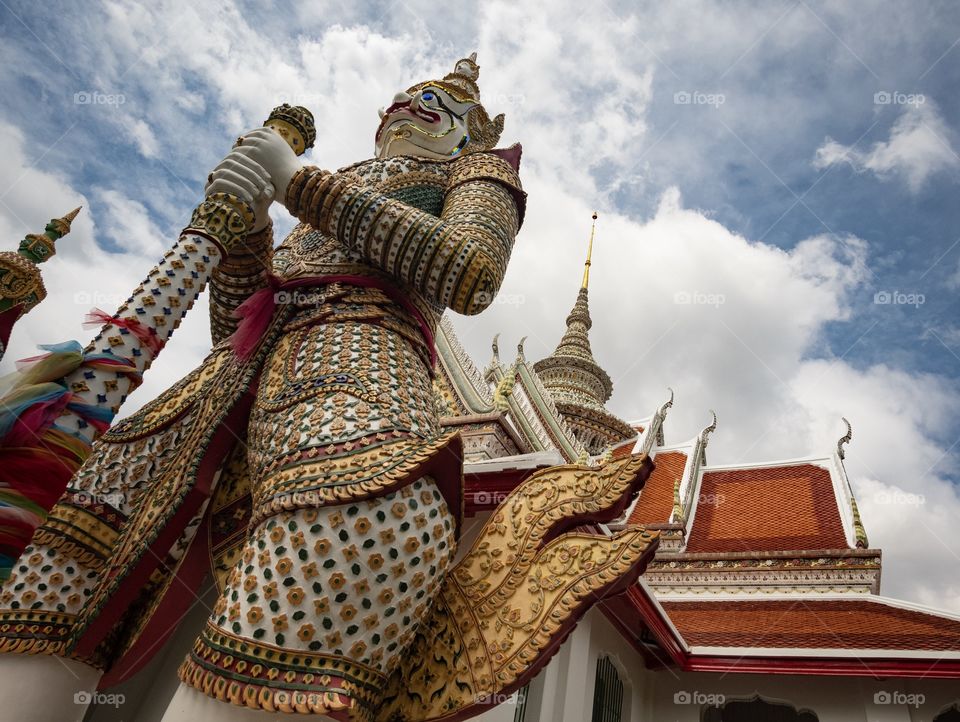 The famous Giant statue of Wat Chaeng (Wat Arun) in Bangkok Thailand is the favorite art for tourists    