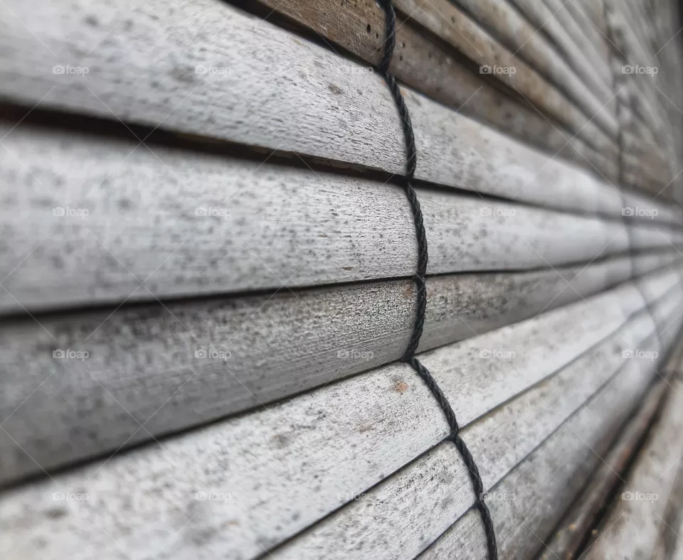 a texture of bamboo curtain taken by mobile phone