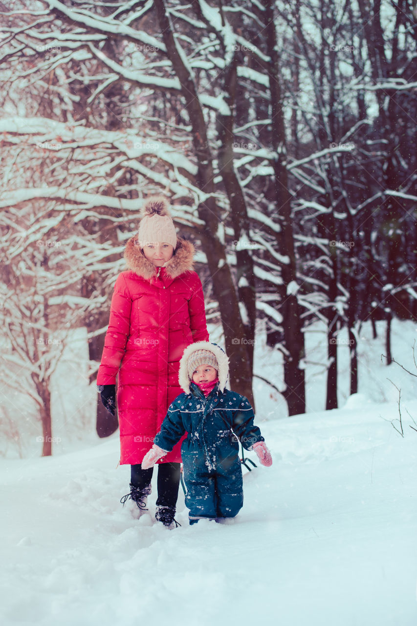 Winter with friends. Spending wintertime outdoors playing with snow