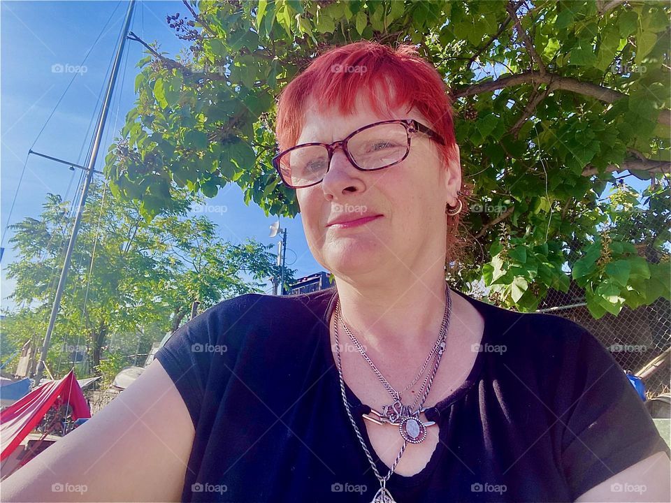 I, “Petra Schiller” a.k.a. “Maxine Firefox” a.k.a. “Maximiliane Feuerfuchs” am standing aboard the “Salvation”, our “28 ft 1969 Luhrs” cabin cruiser on a hot sunny summertime afternoon in August of 2023. Hypnotic Productions