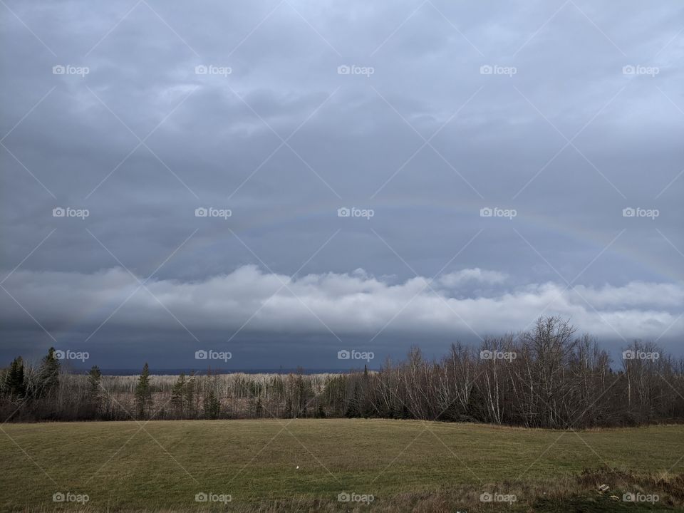 Rainbow in cloudy sky