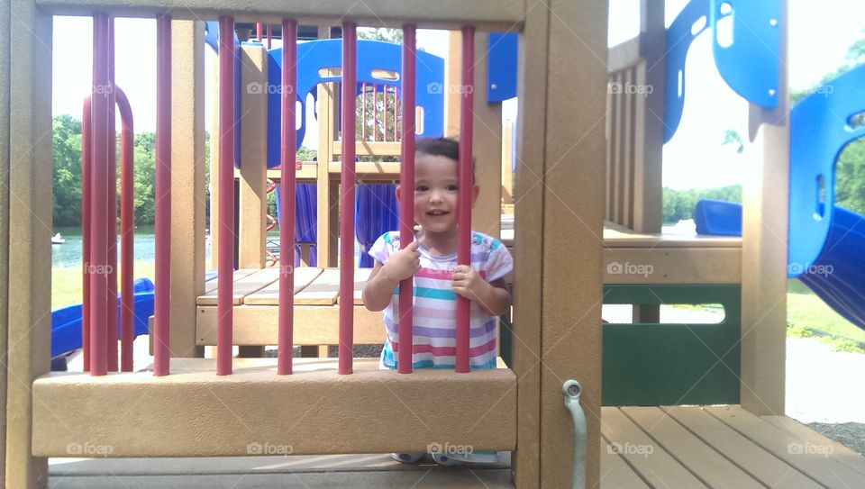 Noureen happy little girl . playing in playground 