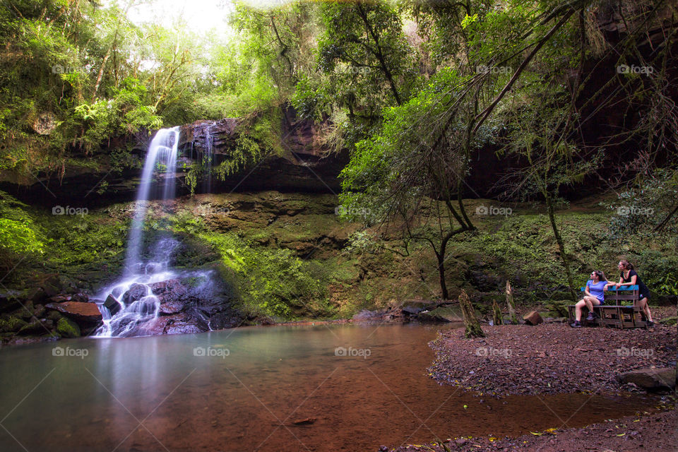 Girls looking at the waterfall