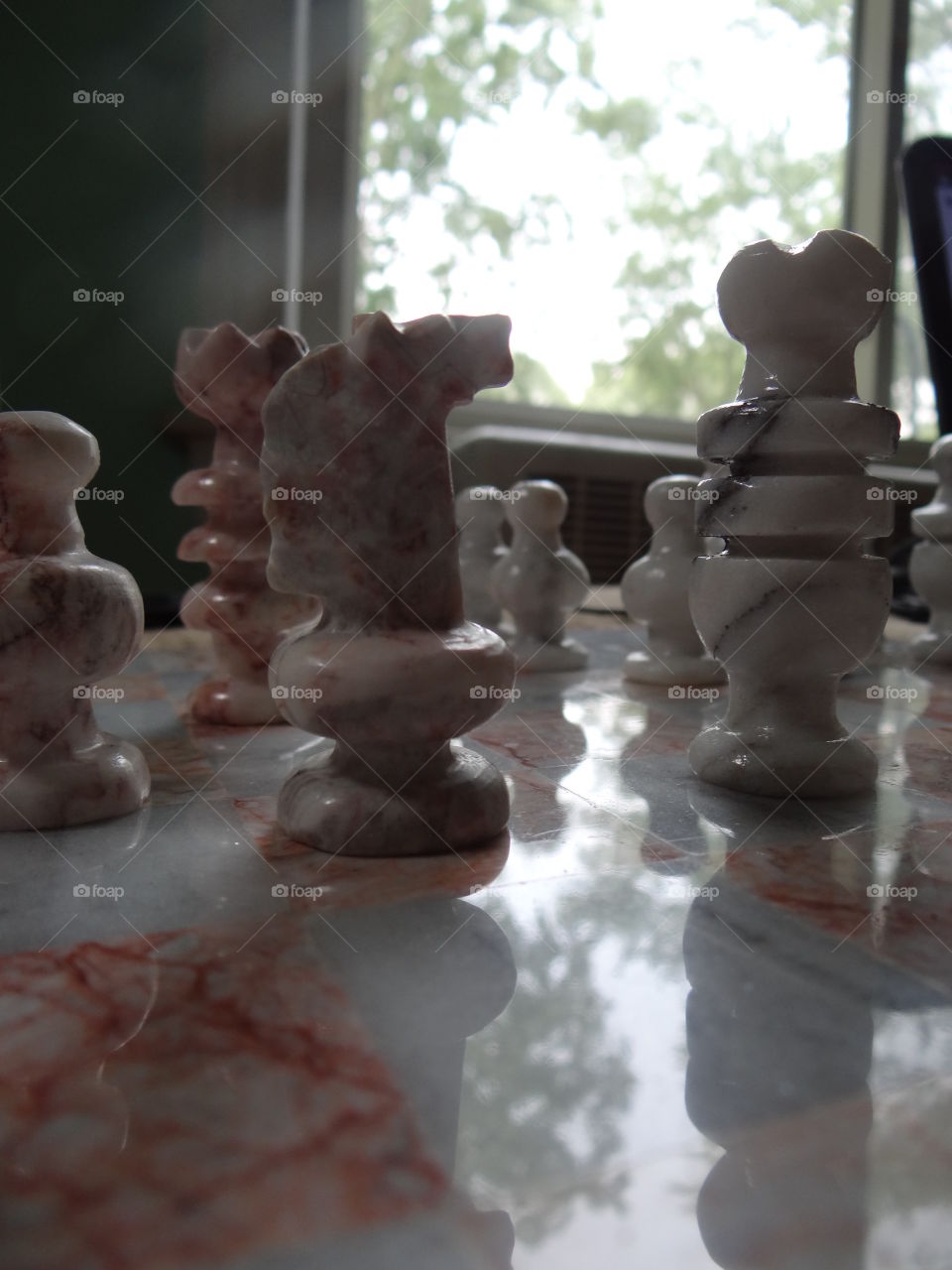 Chess board. Marble chess set, natural light 