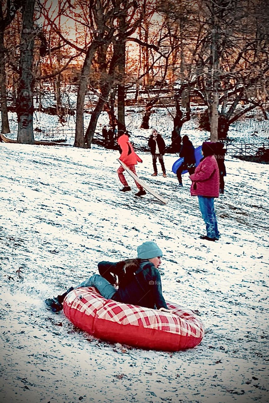 Sledding on inflatable floaty, first snow 