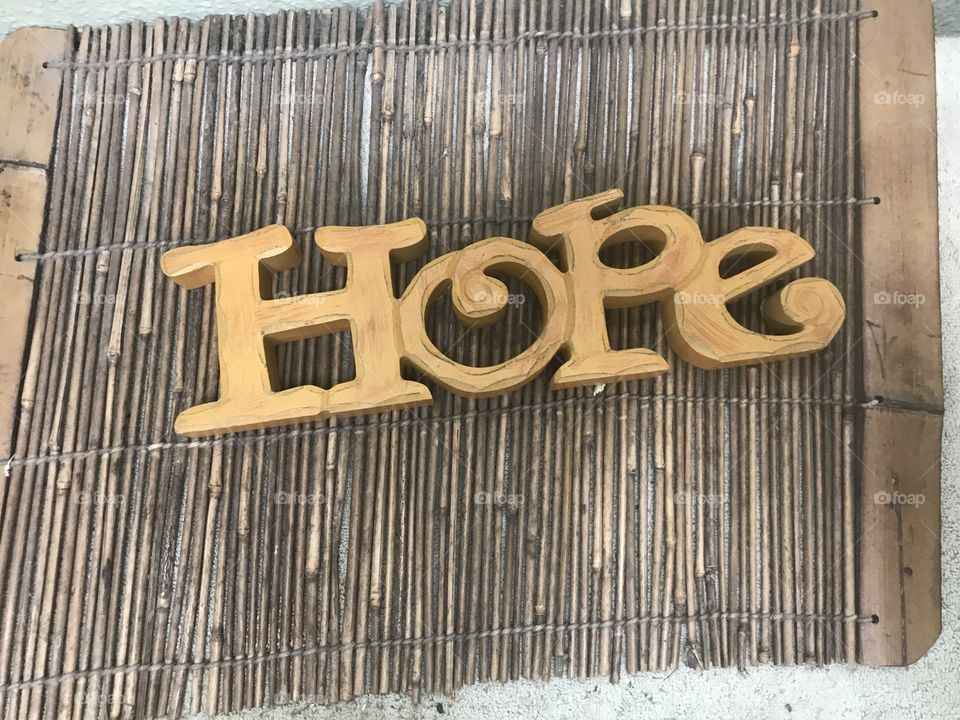 A wooden saying of the word Hope- 