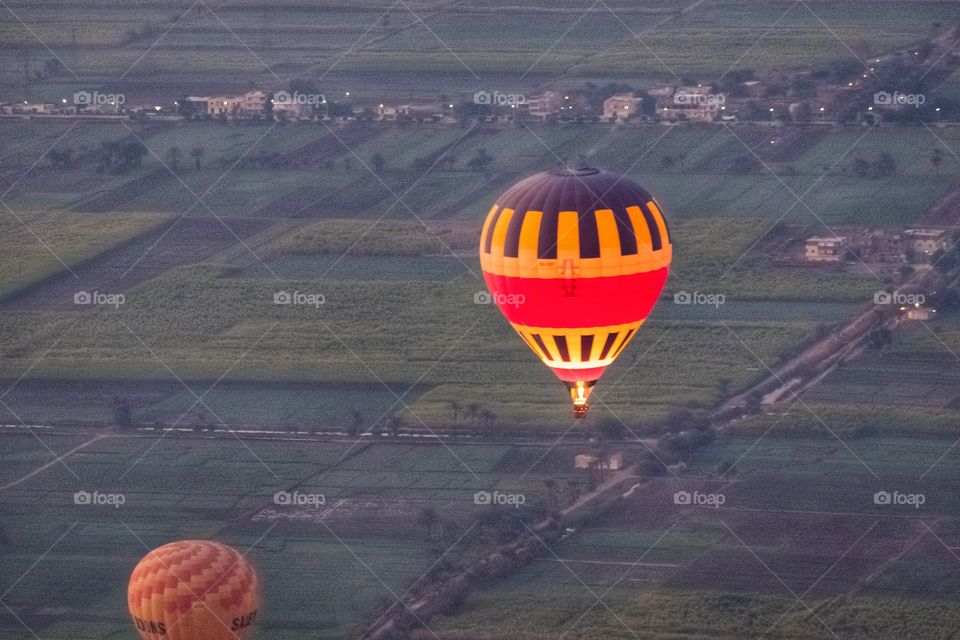 Balloon over plantation scene