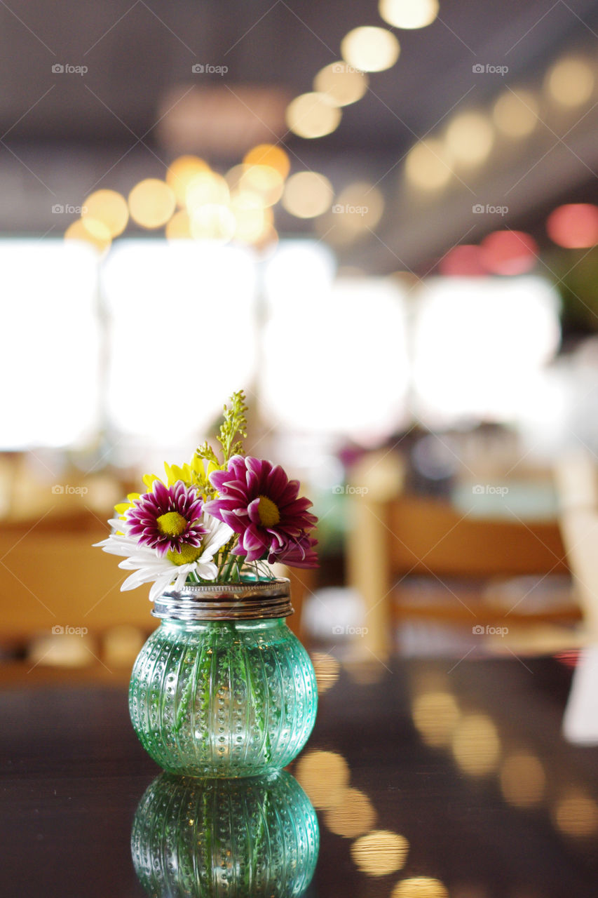 Flower bouquet on wood diner table