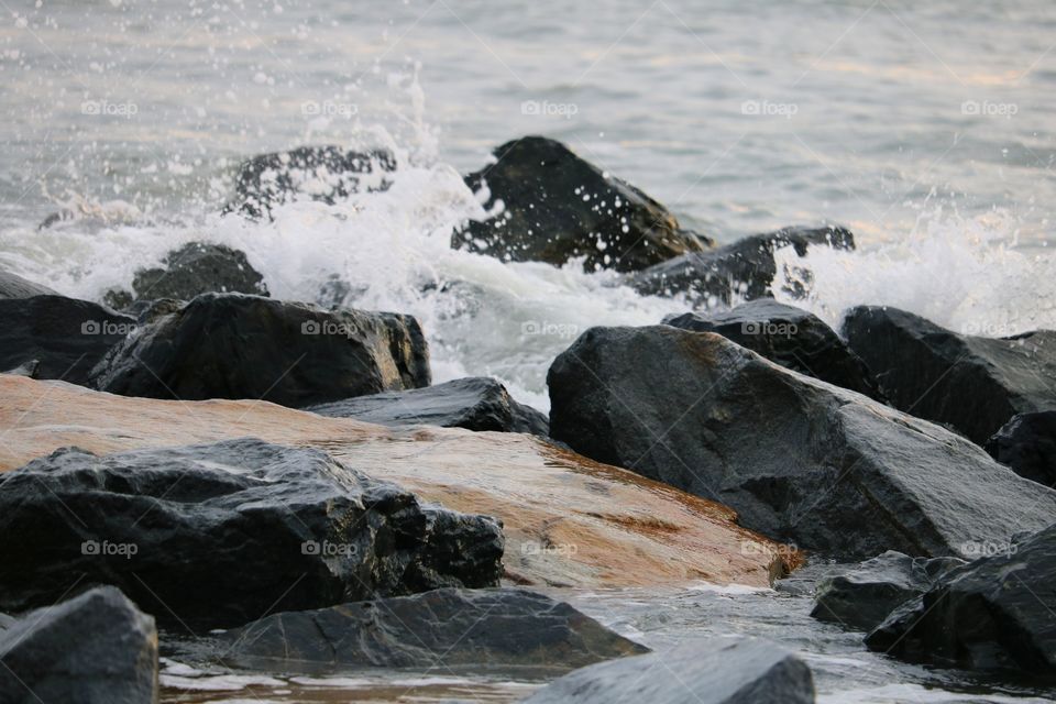 waves splashing on rocks