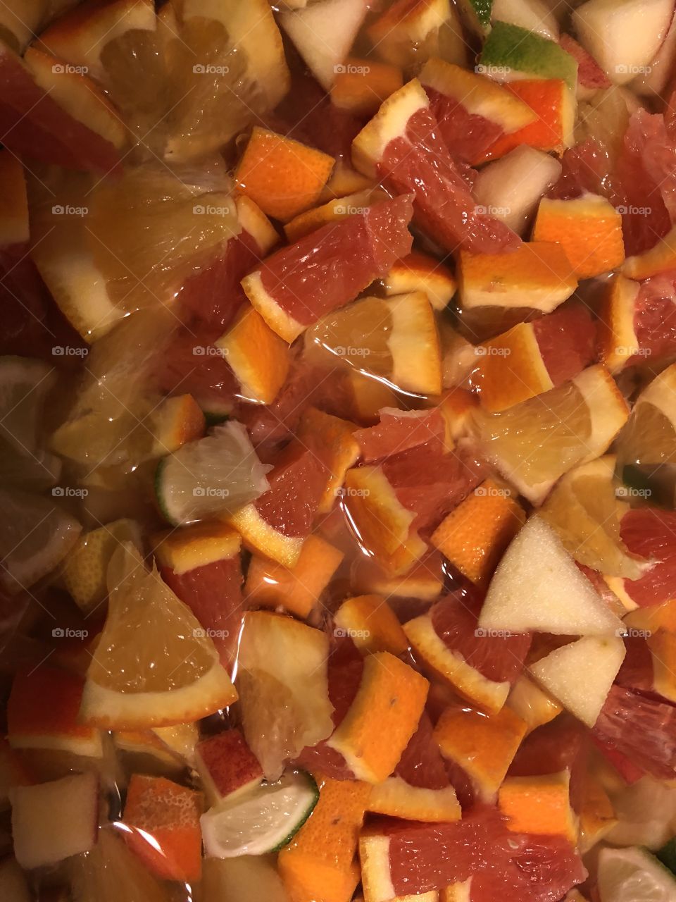 Chopped lemons oranges and apples ready for sangria 