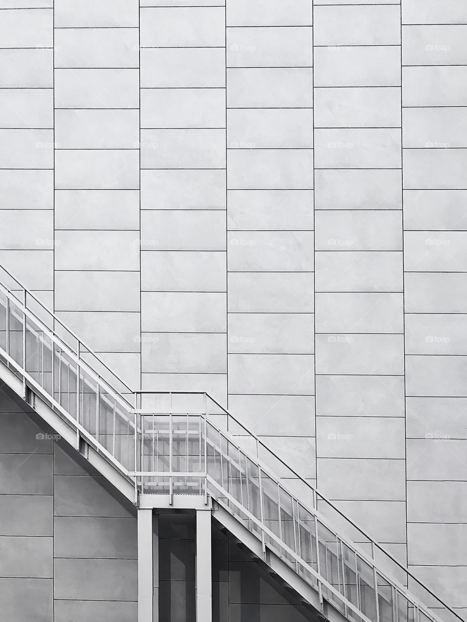 Minimal concept of metal Steps on geometric brick wall background black and white 