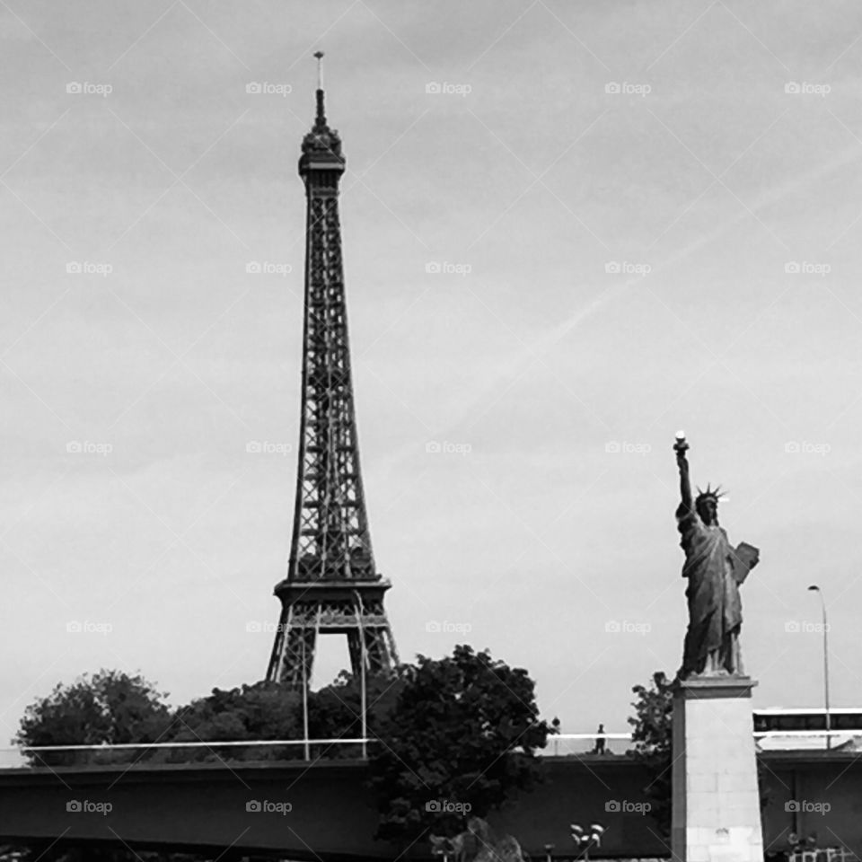 The Eiffel Tower and The Statue Of Liberty In Paris France