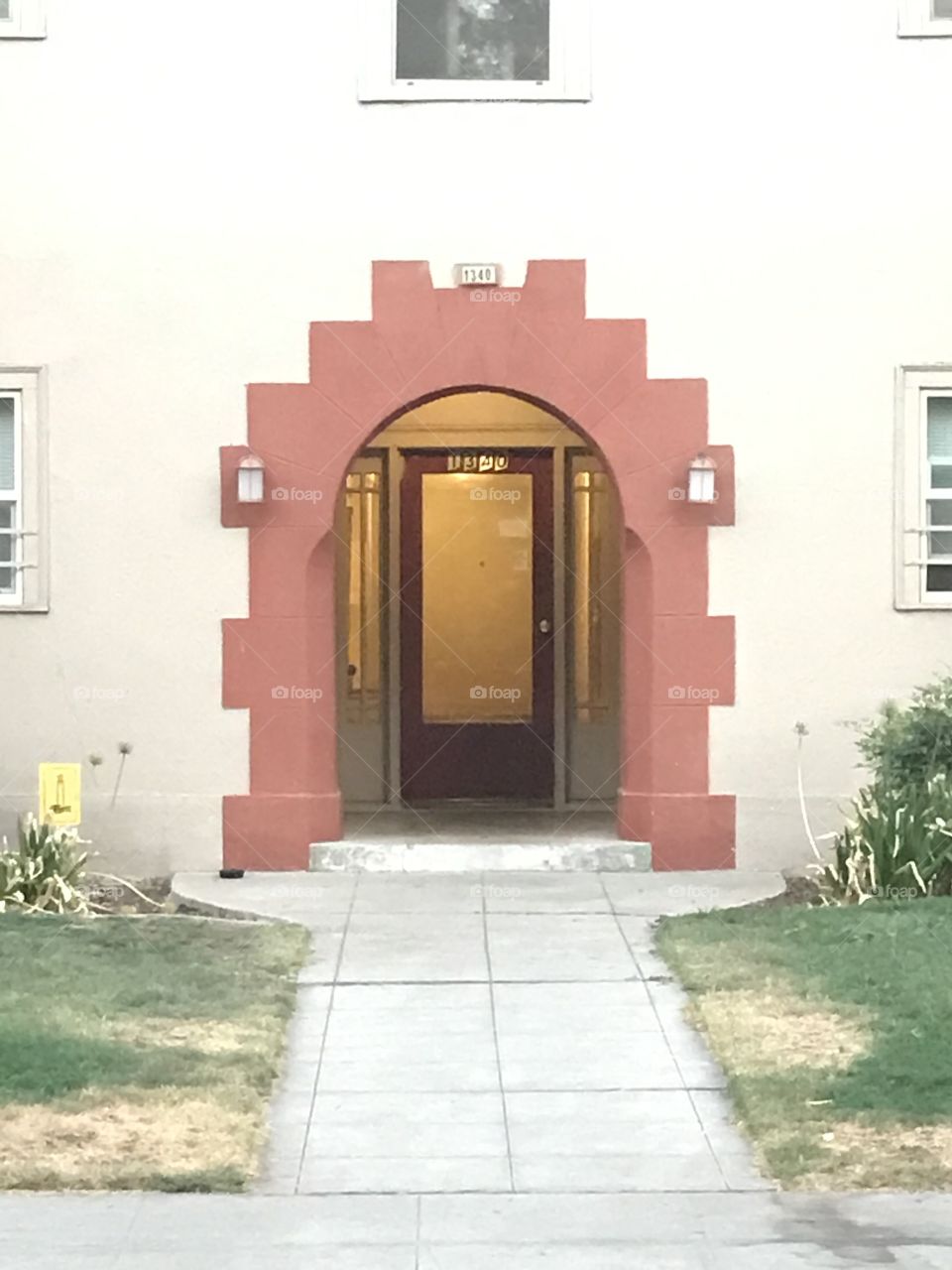 The main entry into an apartment building. All residents dwell in one building but in separate apartment homes under one roof.