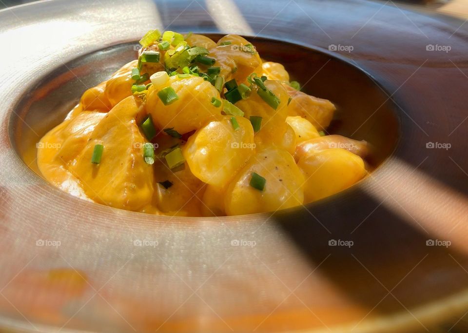 Capture the essence of Italy with this vibrant gnocchi! Aesthetic contrasts, rich colors, and perfect lighting make this photo a feast for the eyes. Ideal for food blogs, Italian cuisine campaigns, or culinary inspiration.