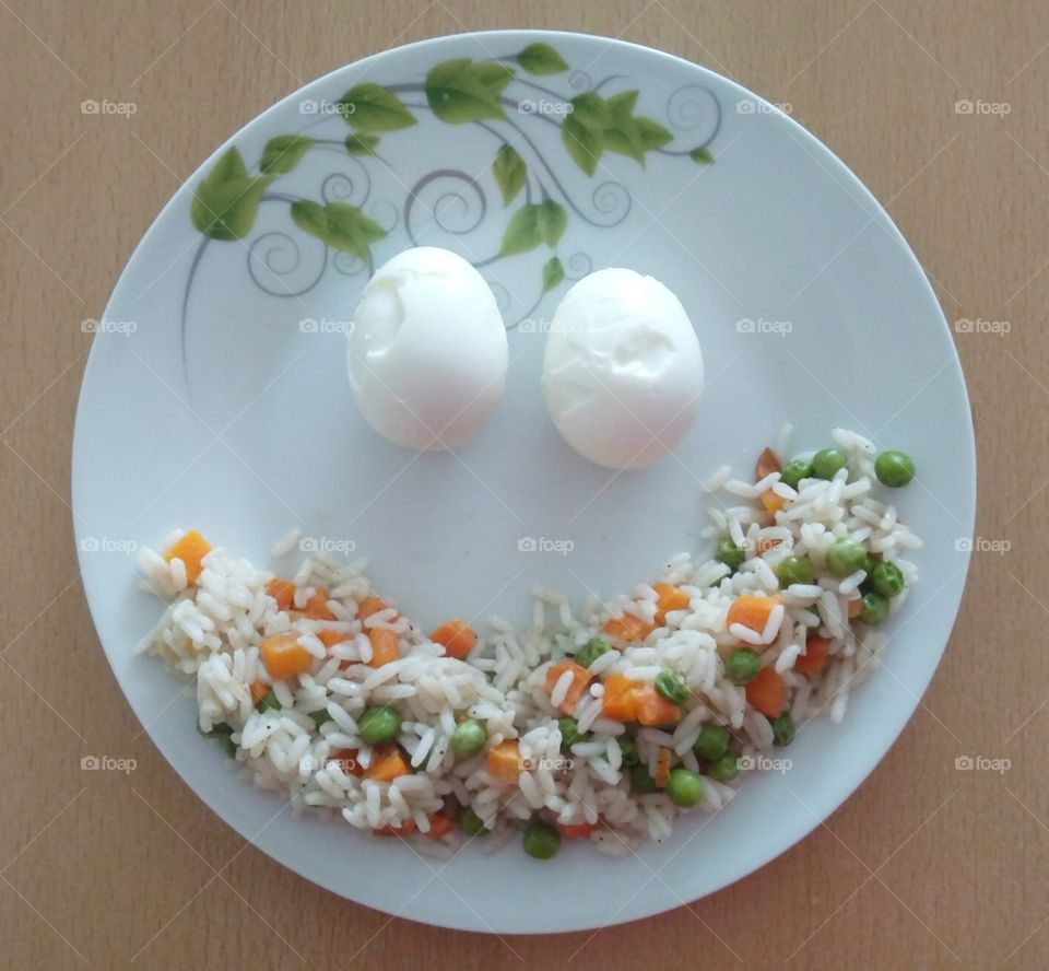 Two eggs and the rice with vegetables