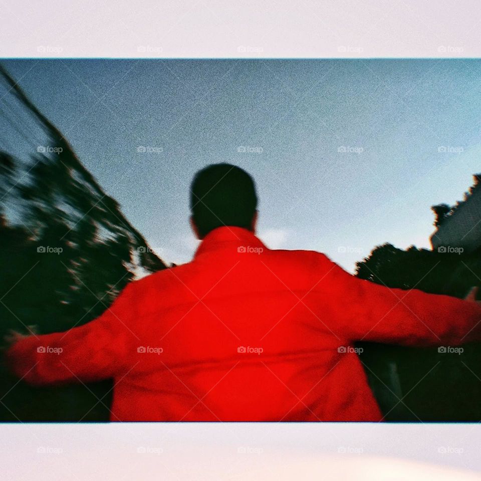 My brother picture standing with back.