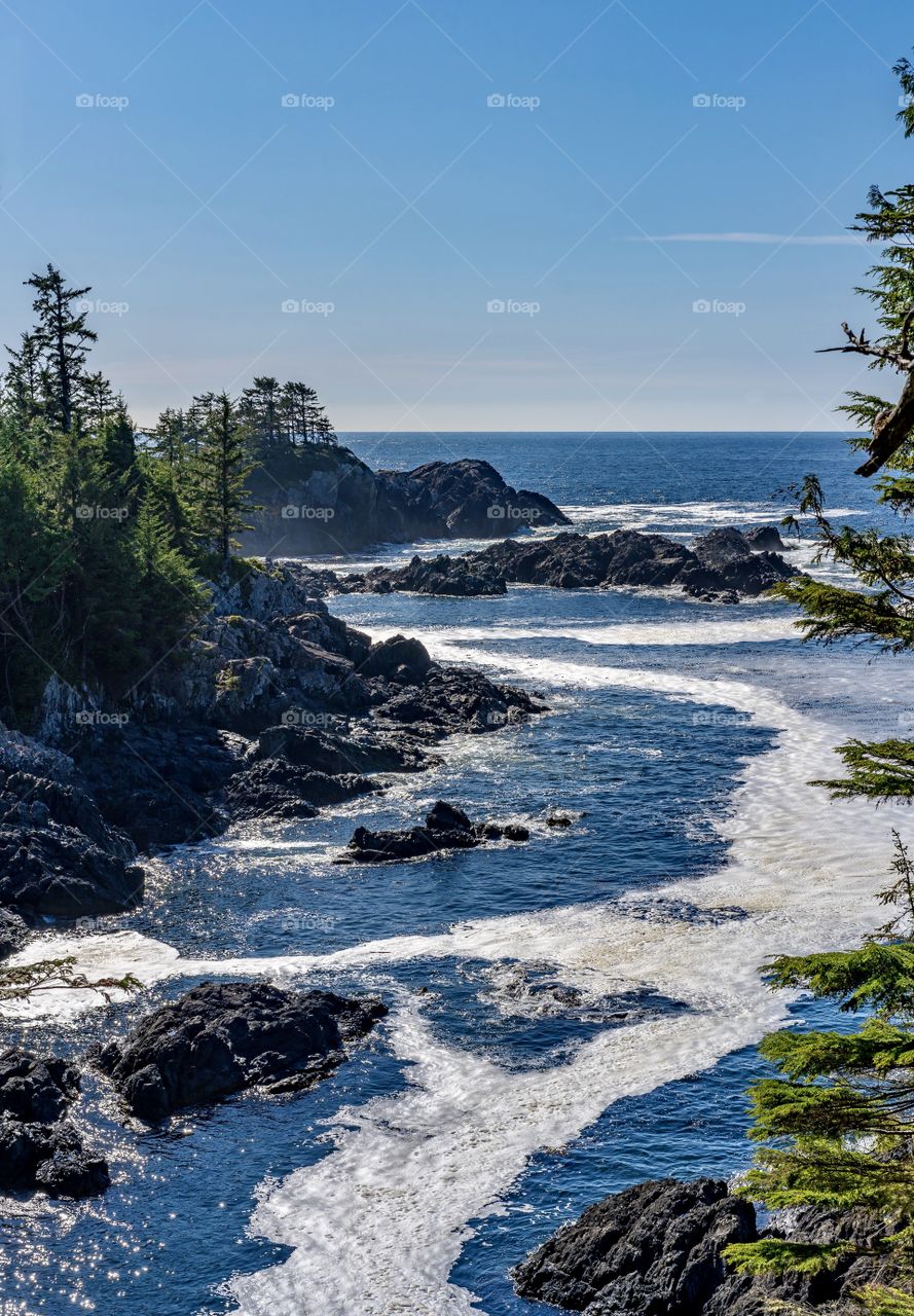 Swirling ocean water and rugged rocks at Wild Pacific Trail in Ucluelet, British Columbia, Canada