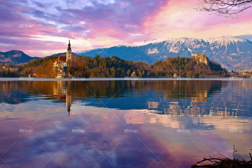A dramatic sky and still lake in Bled, Slovenia.