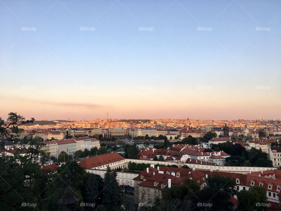 sunset from prague castle, view of prague city, city landscape with red rooftops