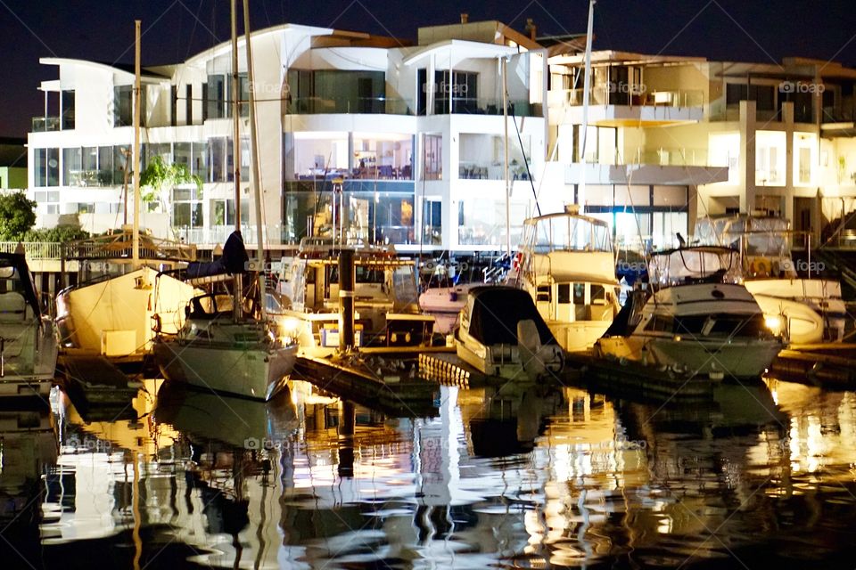 Reflections of building and boats