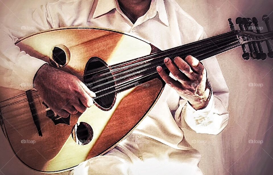 Our. Arabic musician playing oud 