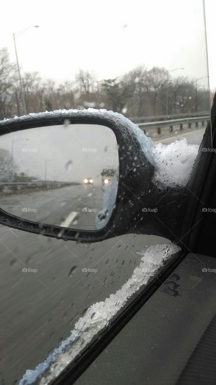 icy drive. freezing rain on the mirror