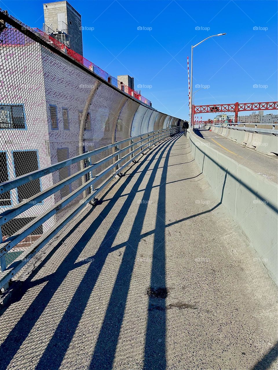 On a sunny day the intricate structures of the “Pulaski Bridge” at “Newtown Creek”, the bridge that connects “Greenpoint”, Bklyn to LIC, Queens are further enhanced by the shadows they cast. 2023. Hypnotic Productions
