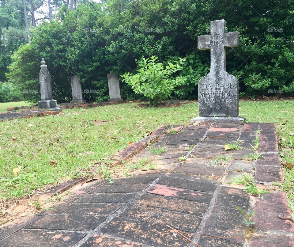 Old headstone grave site in a cemetery 