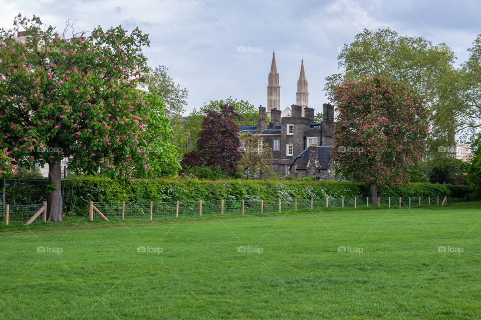 Edwardian style architecture surrounding Regents Park in centre of London. Old mansion in the park. UK.