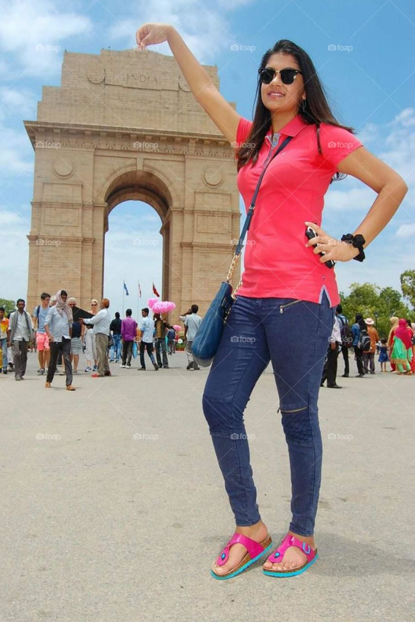 cute girl with India gate building touch , new Delhi India gate