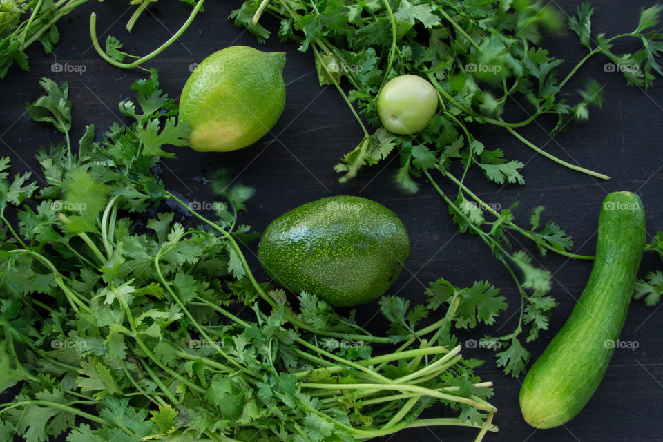 Cilantro, Lemon, a small Tomato that didn't yet grow up, a Cucumber and an Avocado.