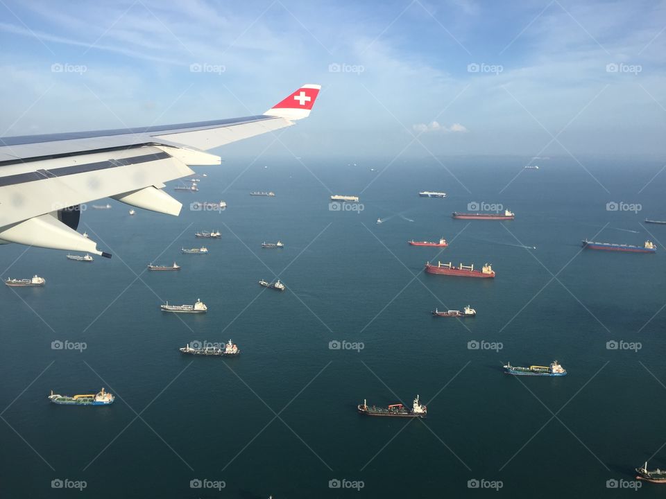 Swiss airplane – Boats on the ocean