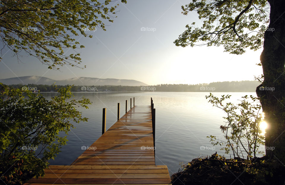 lake winnipesaukee new hampshire lake sunrise dock by bobmanley