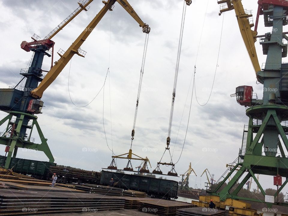 The loading works on the cargo terminal. The cargo cranes with magnetic loader. Izmail sea commercial port. 