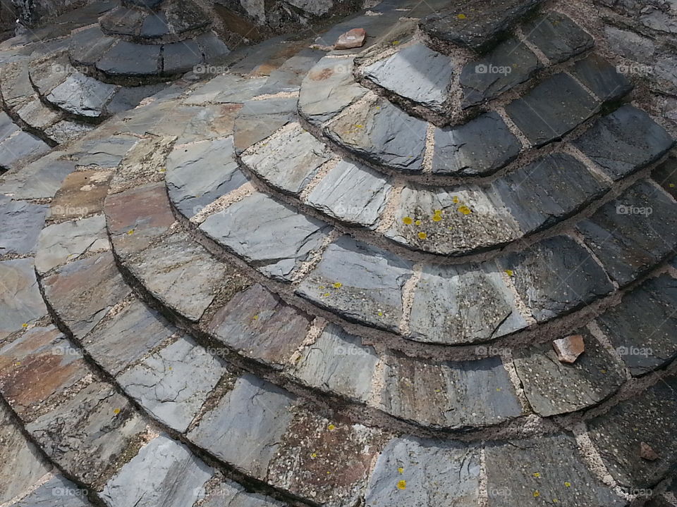 The ruggedness of a pyrenean mountain village roof ...