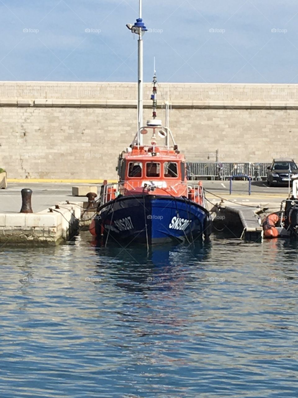 Orange rescue boat in harbor 