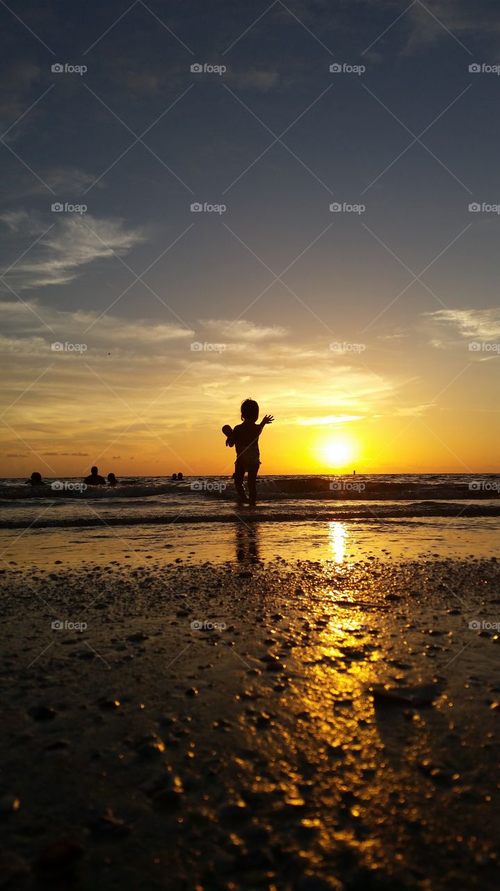 Sunset Reflections Child with Doll