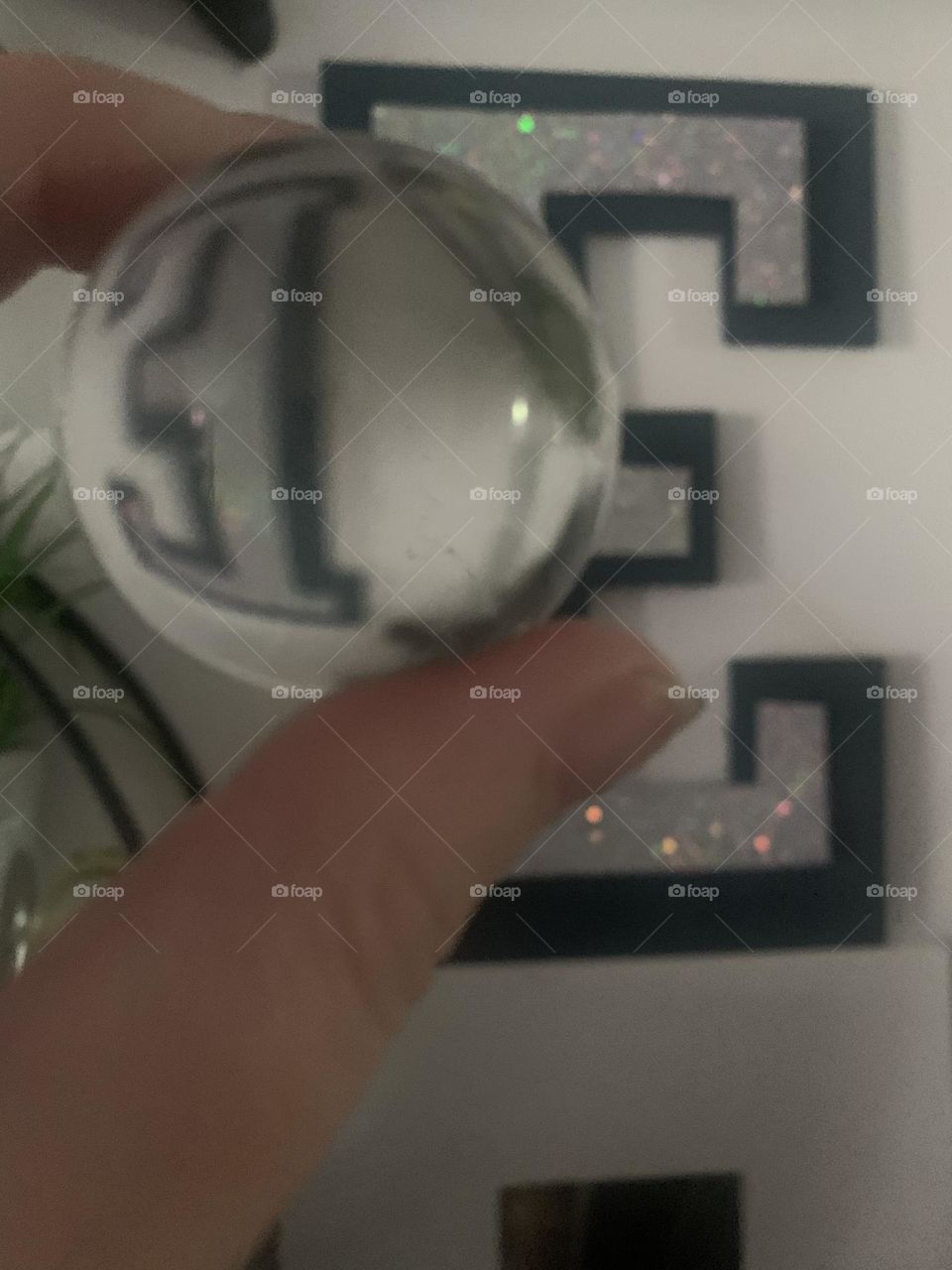 Crystal ball reflection letter “E”