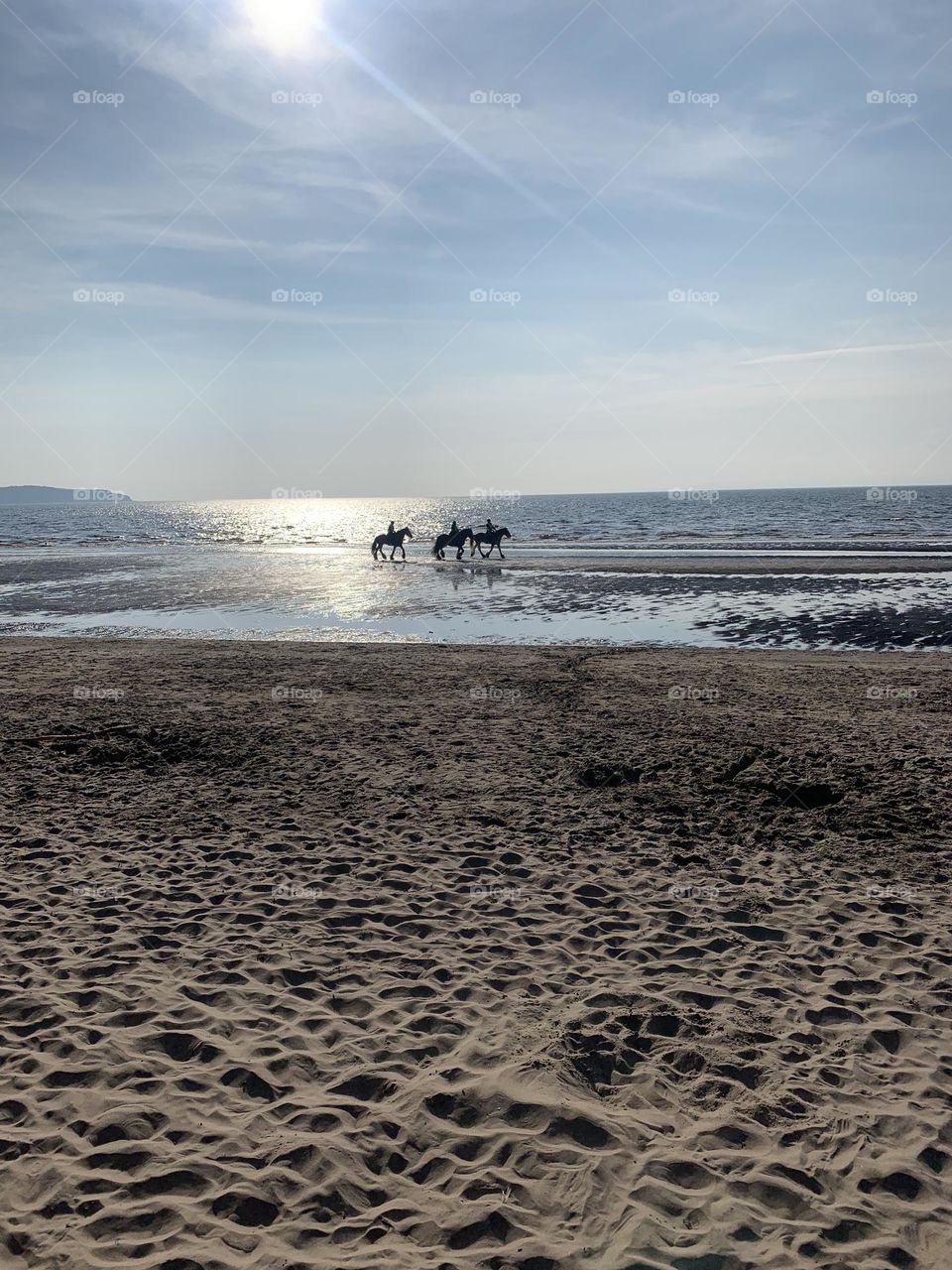 Riders on the sea horizon