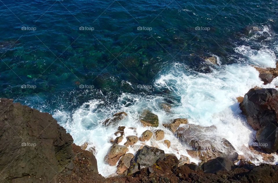 Beautiful clear water and waves crashing on the shore